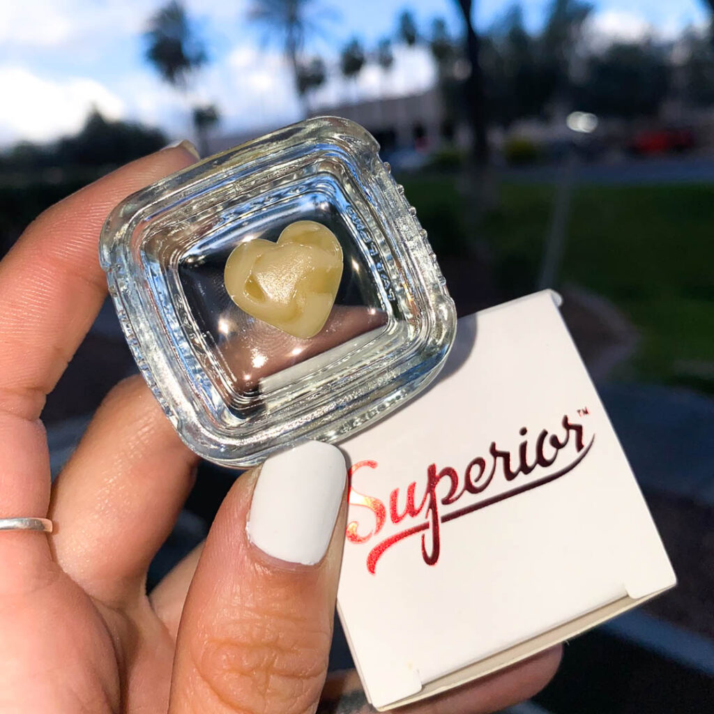 a close up of a heart shaped yellow substance with a superior box