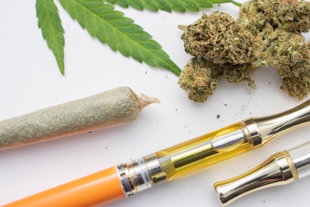 various cannabis products on a white background