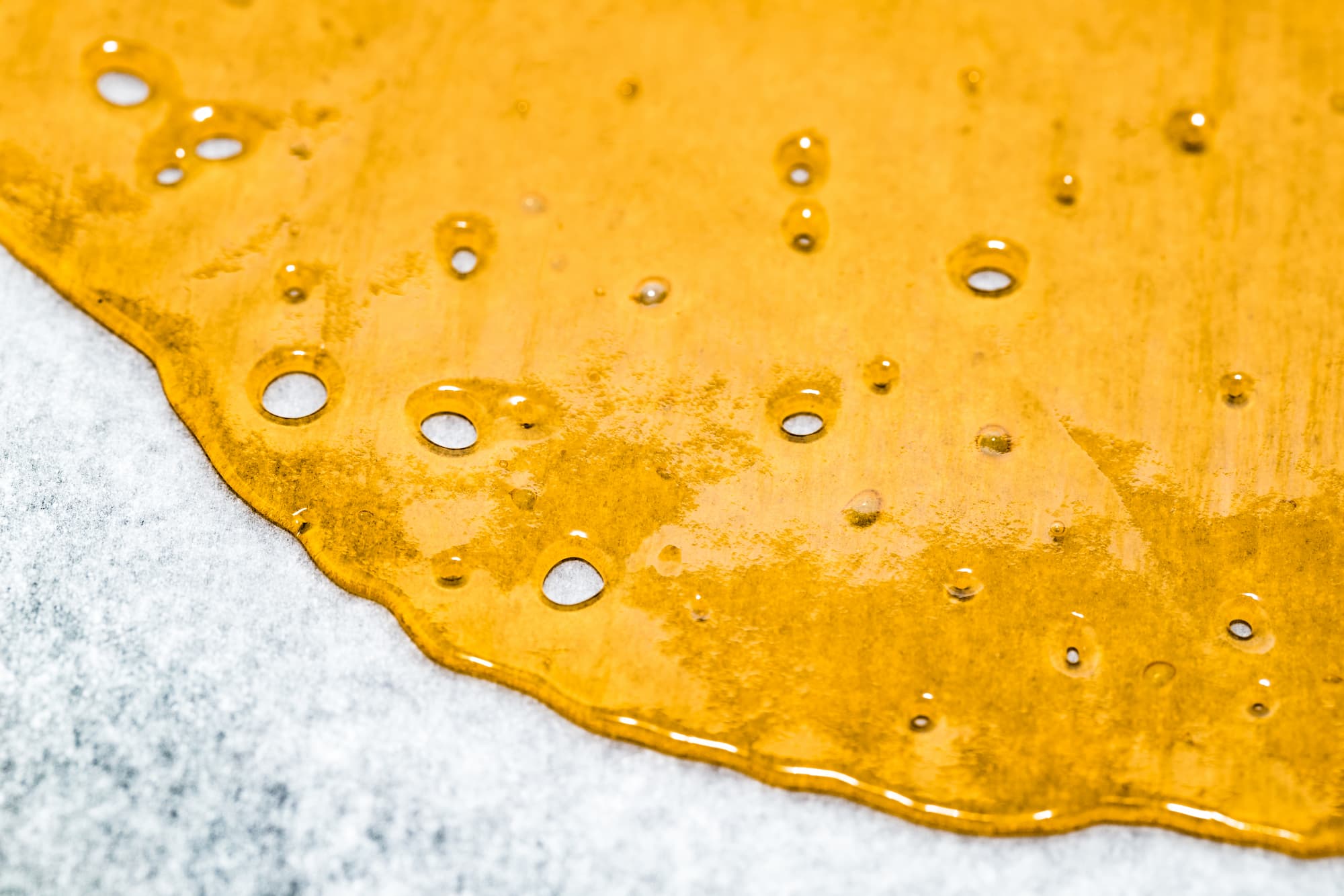 close up image of shatter bubbling on a a piece of parchment paper